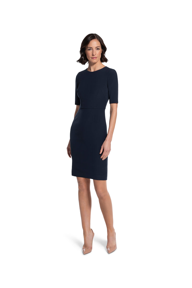 front view of woman 1 wearing the navy alpha dress not your average navy collection