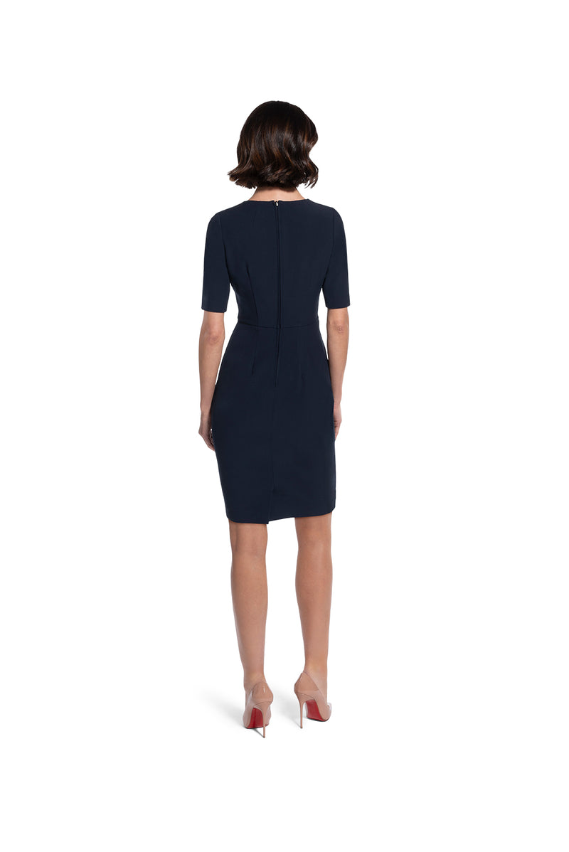 back view of woman 1 wearing the navy alpha dress changednot your average navy collection